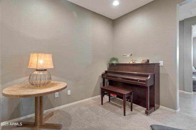 living area with carpet floors and baseboards