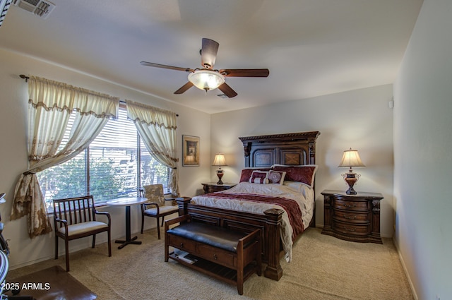 bedroom featuring baseboards, visible vents, ceiling fan, and carpet flooring