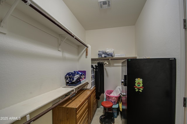 spacious closet featuring visible vents