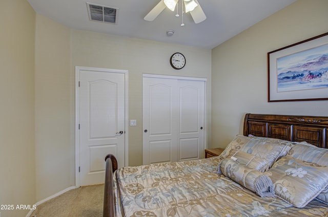 carpeted bedroom with ceiling fan, a closet, visible vents, and baseboards