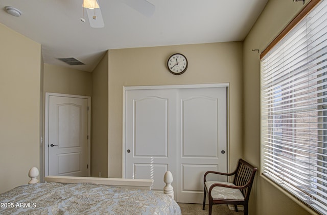 bedroom featuring a ceiling fan, a closet, and visible vents