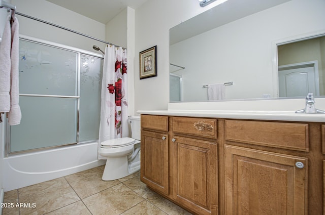 full bathroom featuring toilet, tile patterned flooring, bath / shower combo with glass door, and vanity