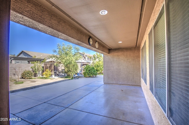 view of patio / terrace featuring fence