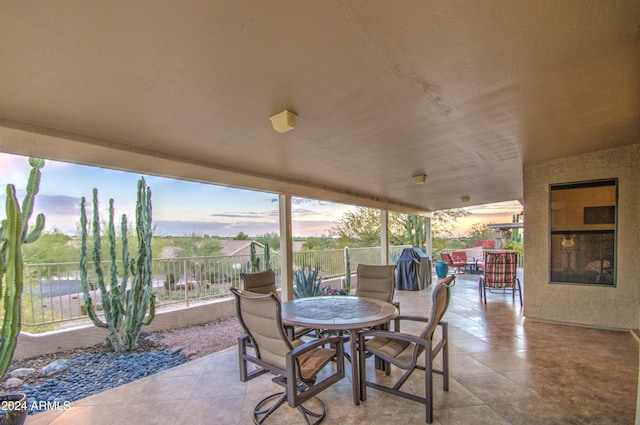 view of patio terrace at dusk