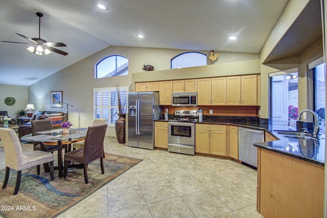 kitchen with ceiling fan, sink, light brown cabinets, light tile patterned floors, and appliances with stainless steel finishes