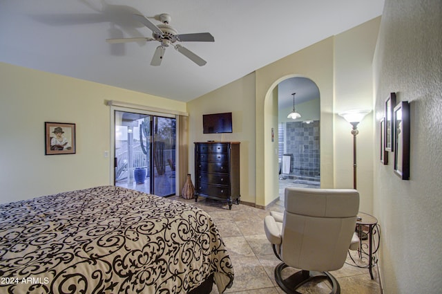 bedroom featuring access to exterior, ensuite bathroom, vaulted ceiling, and ceiling fan