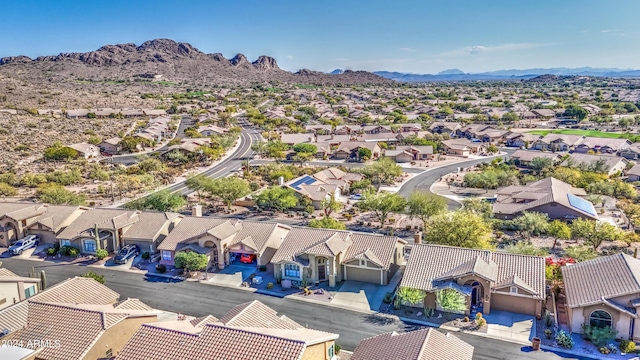 birds eye view of property with a mountain view