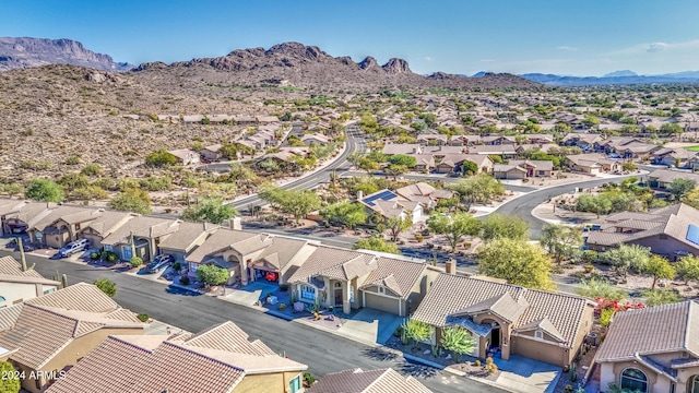 birds eye view of property with a mountain view