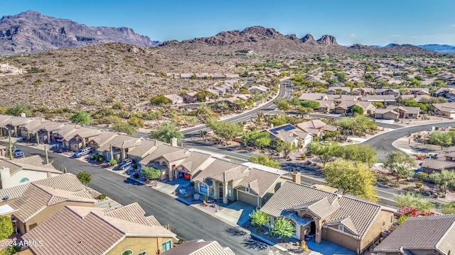 birds eye view of property with a mountain view