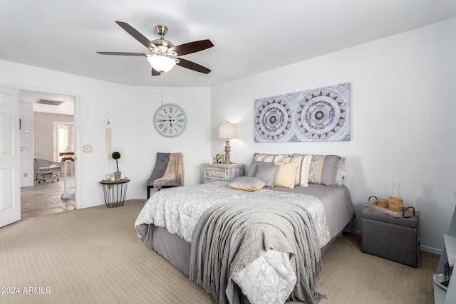 bedroom featuring ceiling fan and light colored carpet