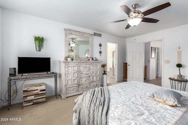 bedroom with light colored carpet and ceiling fan