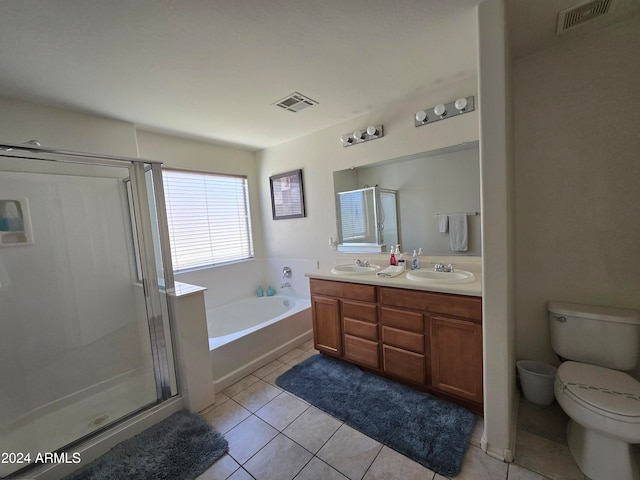 full bathroom featuring vanity, shower with separate bathtub, tile patterned flooring, and toilet