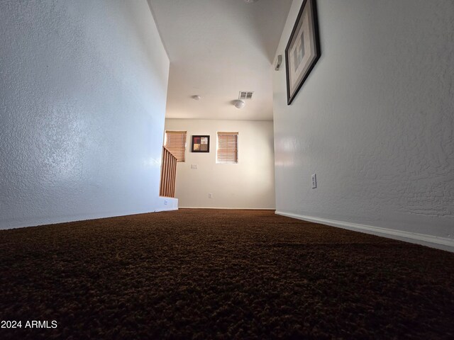 unfurnished room featuring carpet