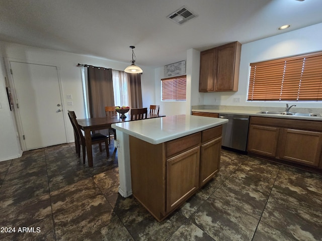 kitchen with a kitchen island, sink, hanging light fixtures, and stainless steel dishwasher