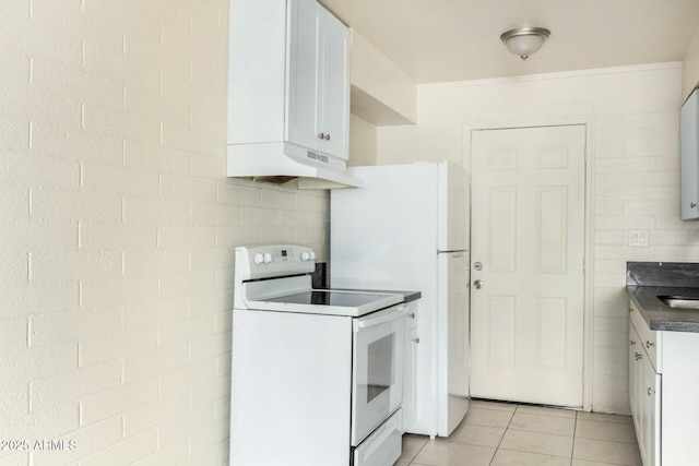 kitchen featuring light tile patterned floors, under cabinet range hood, electric range, white cabinetry, and backsplash