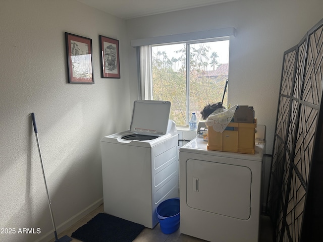 clothes washing area featuring independent washer and dryer