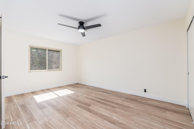 unfurnished room with ceiling fan and light wood-type flooring