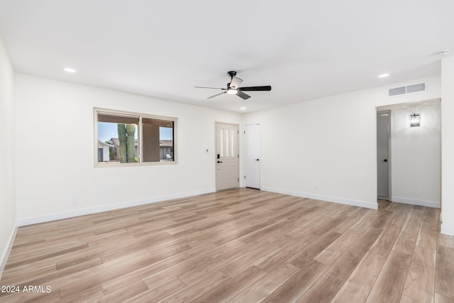 spare room with ceiling fan and light hardwood / wood-style floors