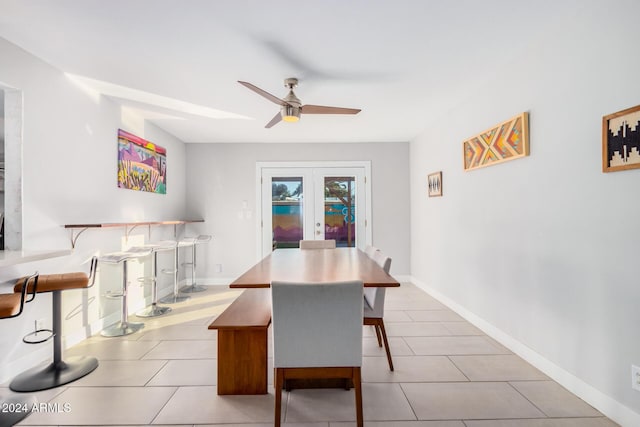 8301 E Crestwood Way, Scottsdale, AZ 85250 - dining area featuring a ceiling fan, light tile patterned floors, and baseboards