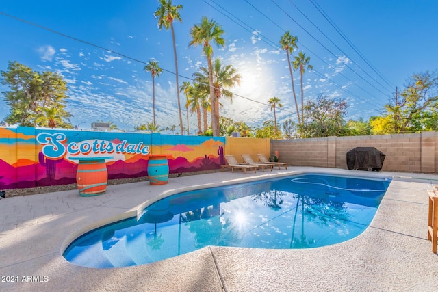 8301 E Crestwood Way, Scottsdale, AZ 85250 - view of swimming pool with a fenced backyard and a patio