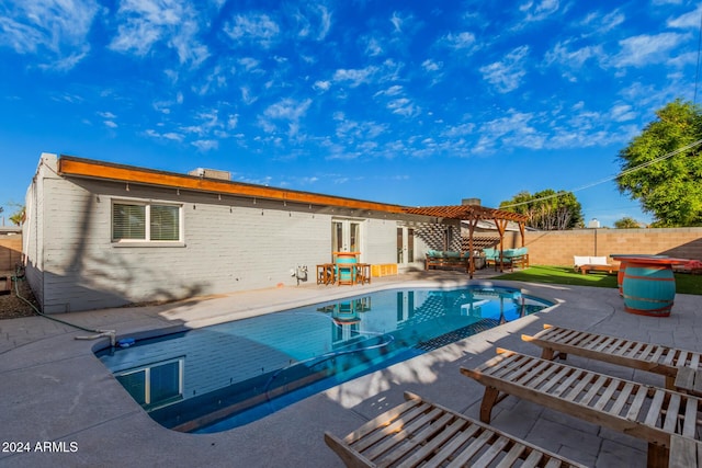 8301 E Crestwood Way, Scottsdale, AZ 85250 - view of pool with a pergola, a fenced backyard, a patio area, and an outdoor hangout area