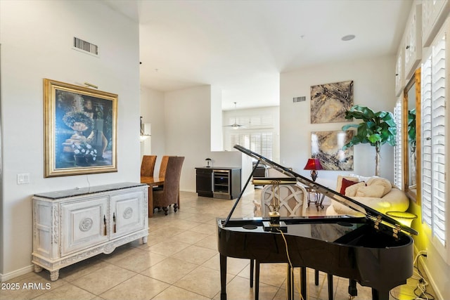 misc room featuring ceiling fan and light tile patterned floors