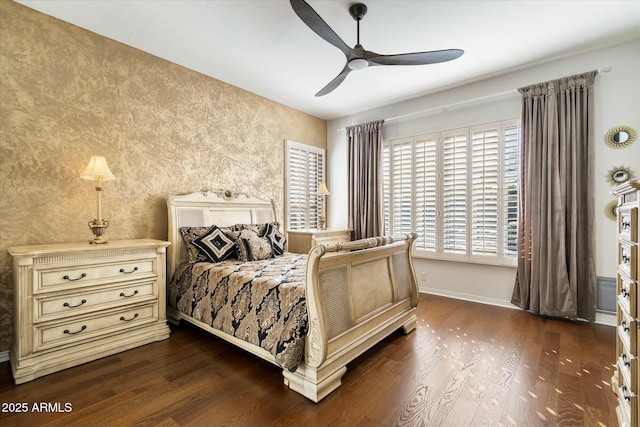 bedroom featuring ceiling fan and dark hardwood / wood-style floors