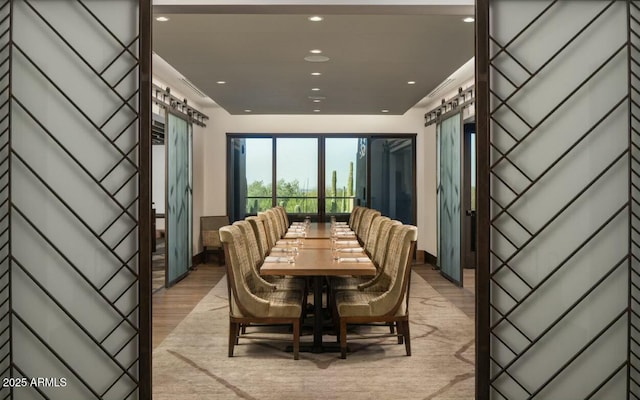 dining space with light hardwood / wood-style flooring