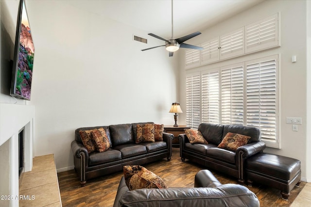 living room with ceiling fan and wood-type flooring