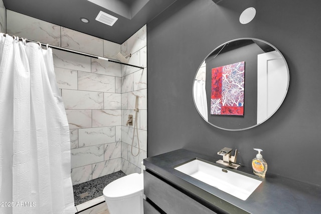 bathroom featuring toilet, vanity, and a shower with shower curtain