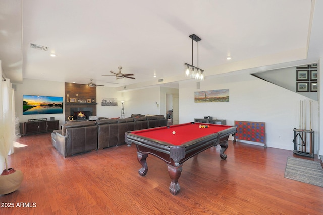 game room featuring hardwood / wood-style flooring, a fireplace, pool table, and ceiling fan