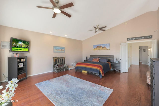 bedroom featuring dark wood-type flooring, vaulted ceiling, and ceiling fan