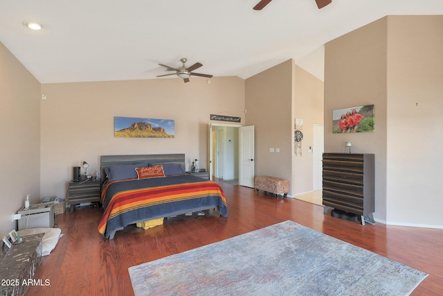 bedroom featuring dark wood-type flooring, ceiling fan, and high vaulted ceiling