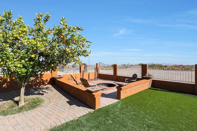 view of patio / terrace featuring an outdoor fire pit