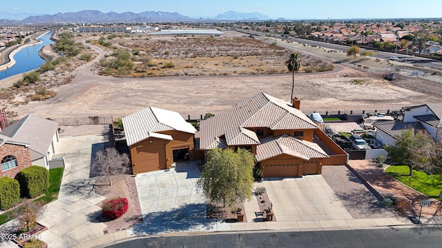 birds eye view of property featuring a mountain view