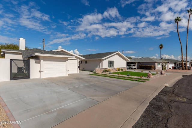 ranch-style home featuring a garage