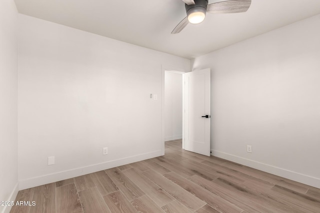 empty room with light hardwood / wood-style floors and ceiling fan