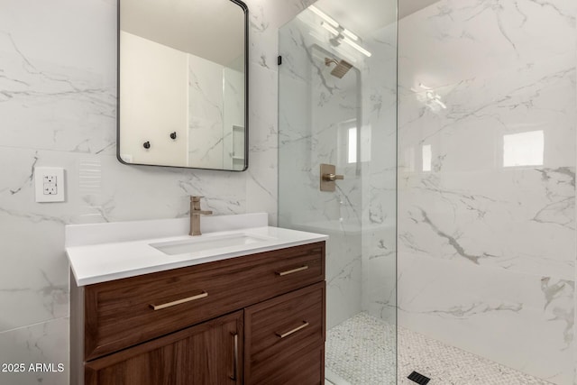 bathroom featuring vanity and a tile shower