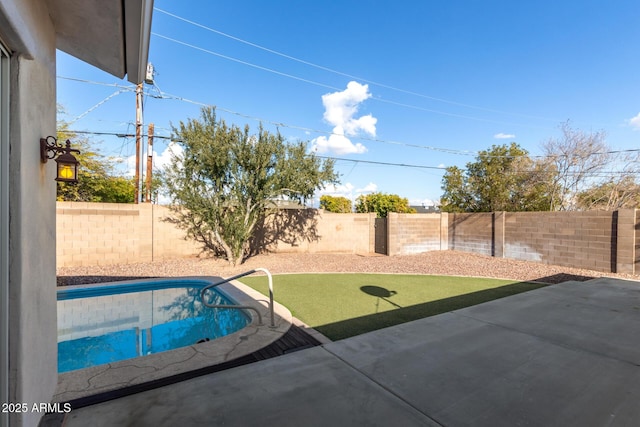 view of swimming pool featuring a patio area