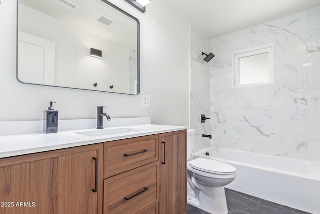 full bathroom with vanity, toilet, and tiled shower / bath