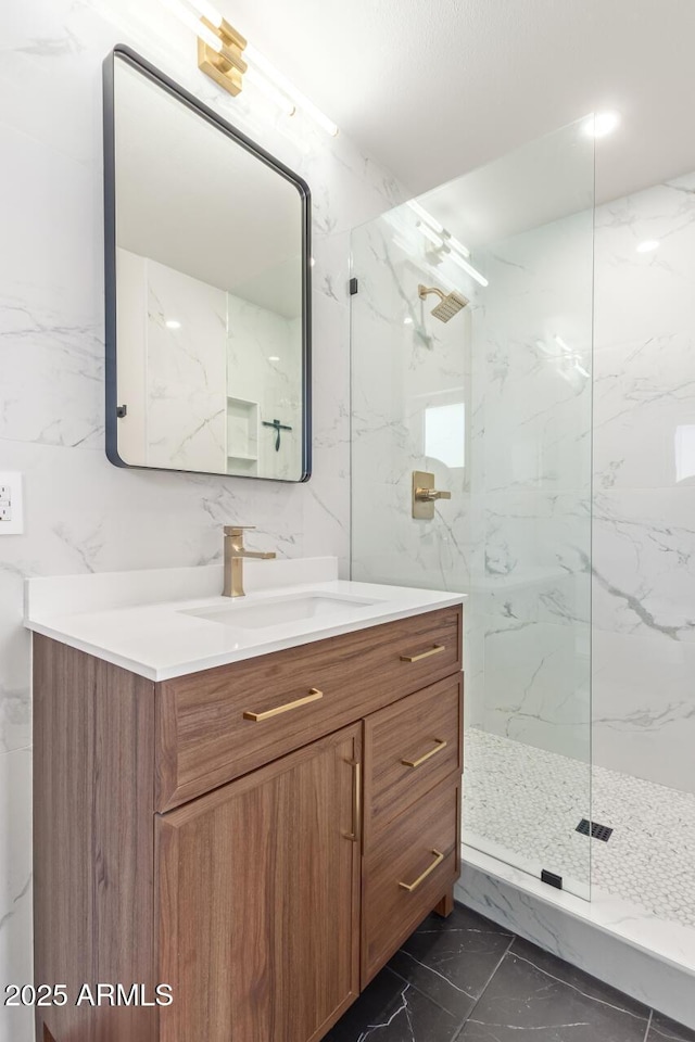 bathroom featuring vanity and a tile shower