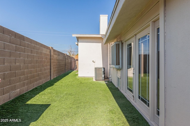 view of yard with central AC