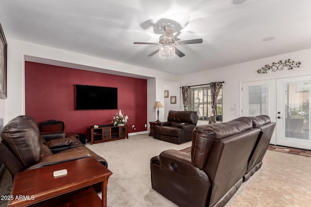 living room with carpet flooring, ceiling fan, and french doors