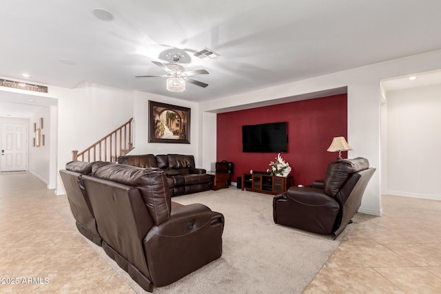 living room featuring ceiling fan and light tile patterned floors