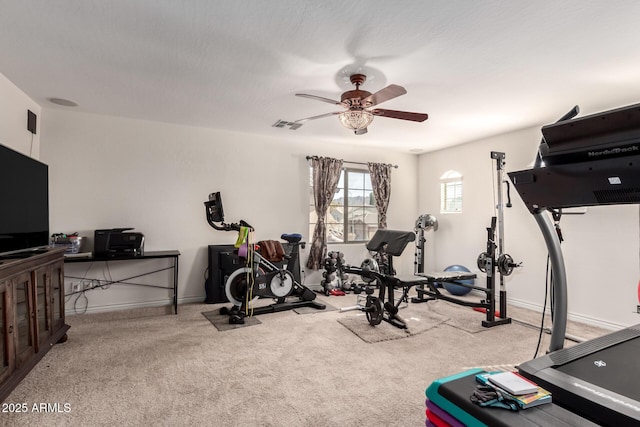 workout area with light carpet and ceiling fan