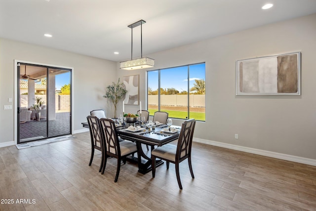 dining space featuring plenty of natural light and light hardwood / wood-style floors