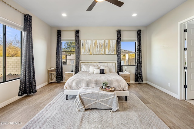 bedroom featuring ceiling fan and light hardwood / wood-style floors