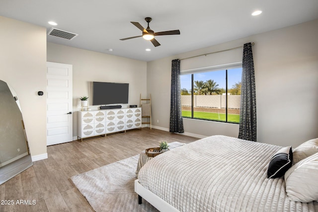 bedroom featuring light hardwood / wood-style flooring and ceiling fan