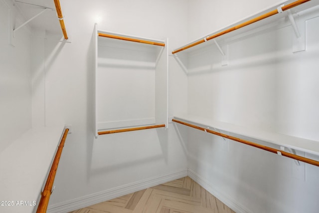 spacious closet with parquet floors