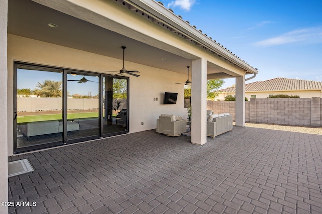 view of patio / terrace featuring ceiling fan